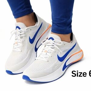 Nike Women's White Sneakers with Blue and Orange Highlights